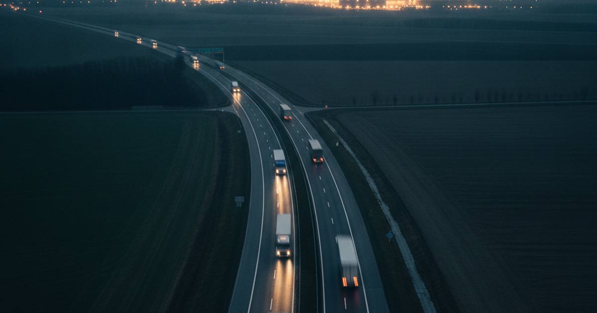 Freight traffic on a European motorway at blue hour