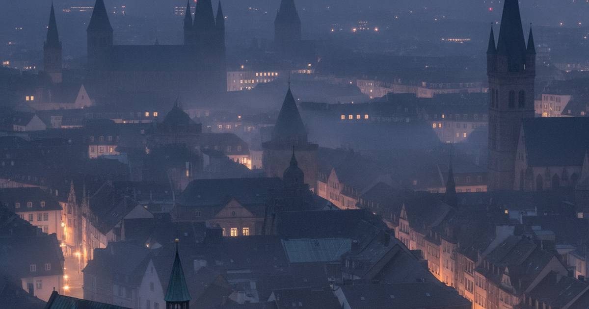 German city rooftops at blue hour